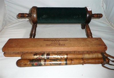 Lot 138 - Two painted truncheons, a cigar shaper and a lace making rest
