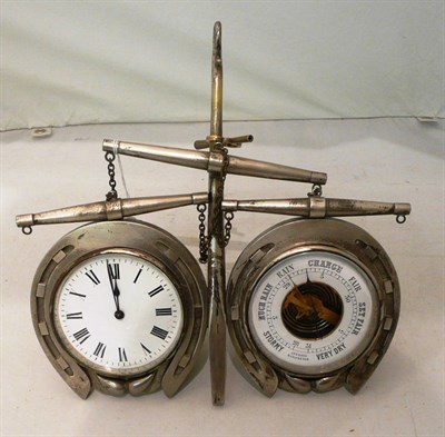 Lot 157 - A silvered desk timepiece combined with an aneroid barometer and key