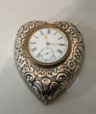 Lot 163 - A heart shaped silver mounted travelling watch in outer fitted case