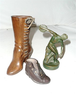 Lot 165 - A bronze model of a discus thrower and two model boots