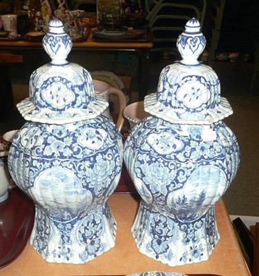 Lot 190 - A pair of 19th century Dutch Delft vases and covers in 18th century style