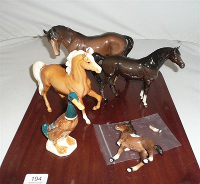 Lot 194 - Four Beswick horses (a.f.) and a Beswick duck (a.f.) (5)