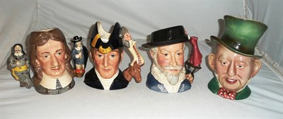 Lot 214 - Three Royal Doulton character jugs and a Beswick character jug (4)