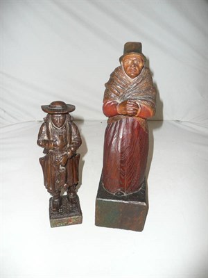 Lot 241 - A Continental carved oak model of a women and a carved wooden model of puss in boots