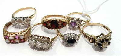 Lot 247 - Seven assorted 9ct gold dress rings, including an amethyst and diamond cluster ring, a garnet...