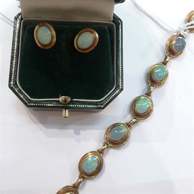 Lot 258 - An opal triplet bracelet and pair of earrings