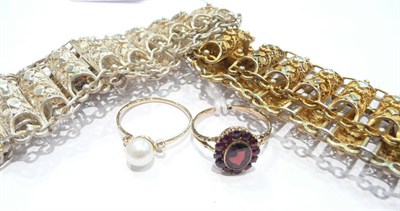 Lot 260 - A garnet cluster ring, a cultured pearl and diamond set ring, two filigree bracelets - both stamped