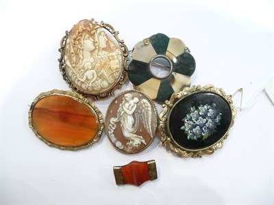 Lot 261 - A micro mosaic brooch, two cameo brooches, a hardstone brooch (a.f.) and two agate brooches