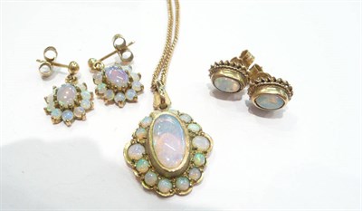 Lot 262 - An opal cluster pendant, earrings and another pair of earrings (possibly composites)