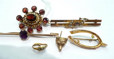 Lot 263 - Two bar brooches, a wishbone brooch (a.f.), a garnet and seed pearl cluster brooch and a single fox
