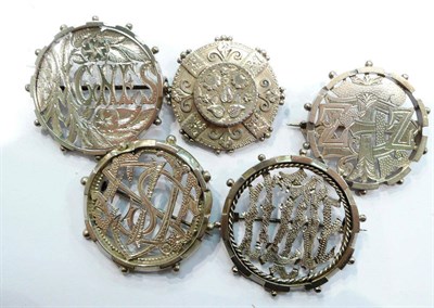 Lot 268 - Five brooches, including four puzzle brooches