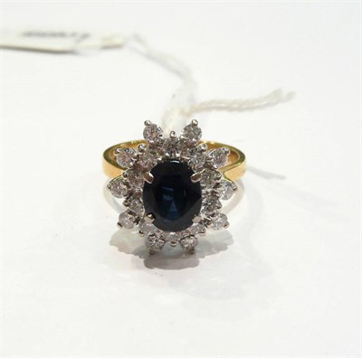 Lot 275 - An 18ct gold sapphire and diamond cluster ring