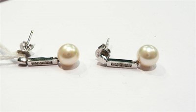 Lot 276 - A pair of 18ct white gold diamond and cultured pearl drop earrings
