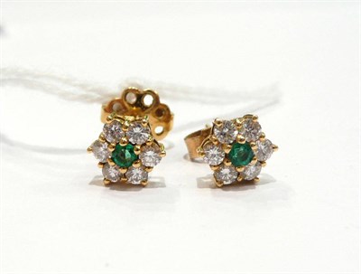 Lot 278 - A pair of emerald and diamond cluster stud earrings