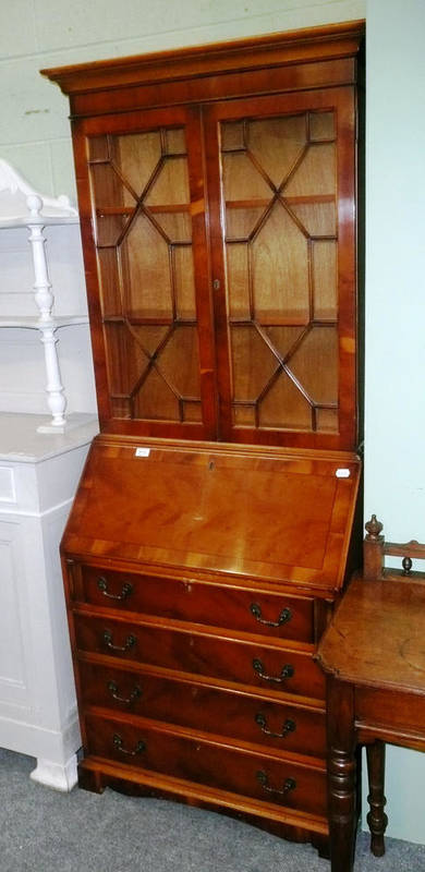 Lot 612 - A reproduction yew wood bureau bookcase