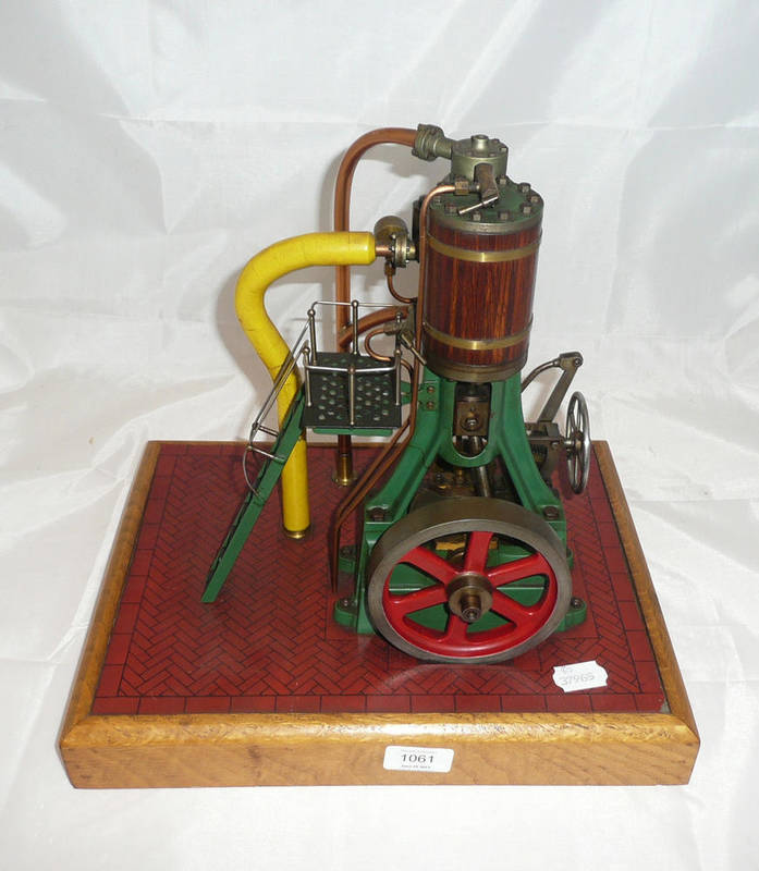 Lot 1061 - A Finely Constructed Live Steam Model of a Single Cylinder Vertical Engine, finished in green, with