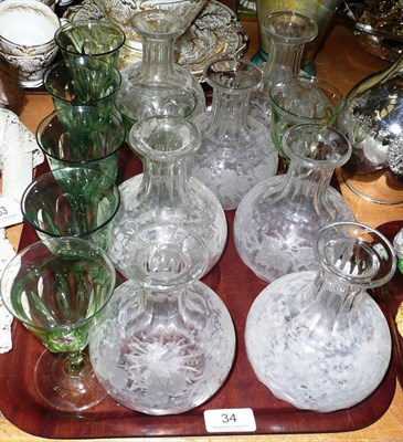 Lot 34 - Seven etched glass carafes and a quantity of green glasses