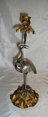 Lot 42 - White metal candlestick modelled as a stork, on a gilt metal base