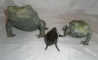 Lot 48 - Two brass toads and a fish