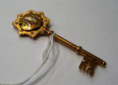 Lot 60 - A cased enamel silver gilt key