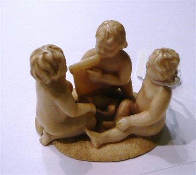 Lot 71 - European ivory figure of three seated children