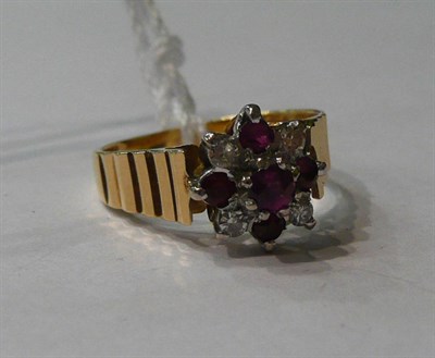 Lot 103 - An 18ct gold diamond and ruby set ring