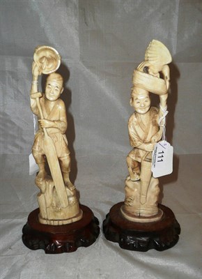 Lot 111 - Two Japanese marine ivory figures with stands