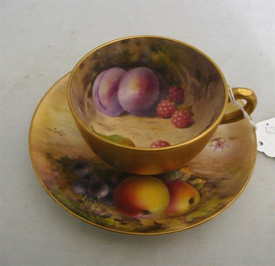 Lot 116 - Royal Worcester fruit painted teacup by A Shuck and a similar saucer by T Lockyer