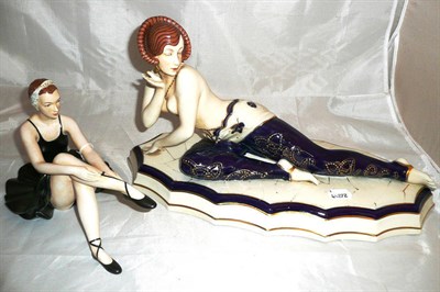 Lot 150 - Royal Dux figure of a seated ballerina and another of a partially dressed reclining lady (2)