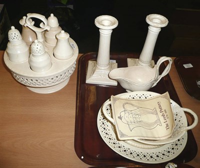 Lot 151 - Pair of modern creamware candlesticks, oval pierced basket and stand, sauce boat and creamware...