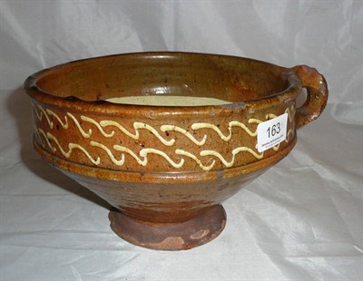 Lot 163 - Early slipware handled bowl