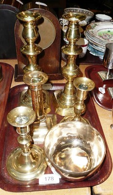 Lot 178 - A pair of brass candle sticks, three others and a bowl