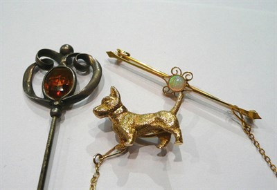 Lot 180 - A scottie dog brooch, an opal bar brooch and a hat pin by Charles Horner