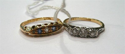 Lot 184 - An 18ct gold diamond and sapphire five stone ring and a diamond three stone ring