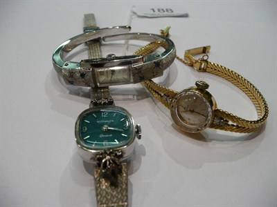 Lot 188 - A lady's wristwatch by Bucherer, diamond set and the strap stamped '750', a lady's bangle...