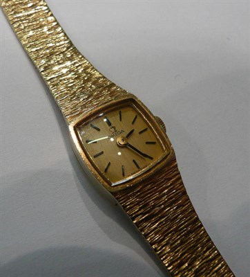 Lot 213 - A lady's wristwatch signed Omega stamped 375