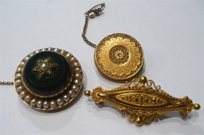 Lot 217 - Seed pearl set circular brooch and two gold brooches