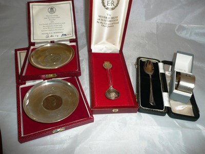 Lot 232 - Silver napkin, silver Christening spoon (cased), silver jubilee spoon (cased) and two silver dishes