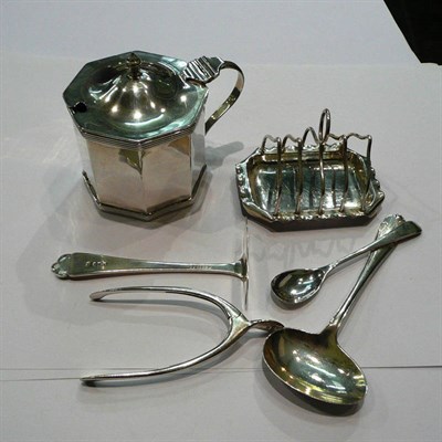 Lot 291 - Silver mustard pot, Tiffany toast rack, spoon and pusher, and a pair of wishbone tongs, 6.5oz