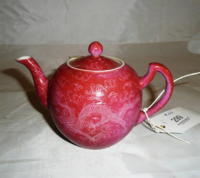 Lot 299 - A 20th century Chinese incised red ground teapot