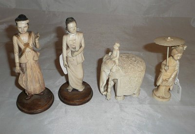 Lot 307 - Ceremonial elephant, lady with parasol, and two Indonesian ivory figures