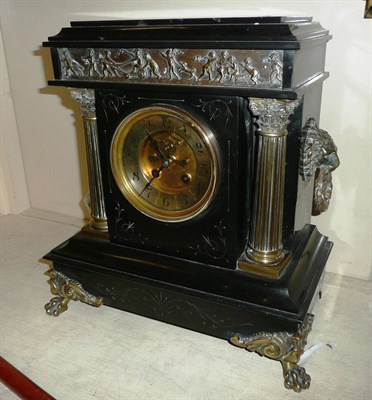 Lot 327 - A black slate striking mantel clock