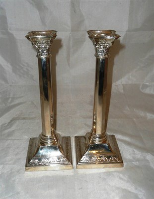 Lot 343 - A pair of silver candlesticks