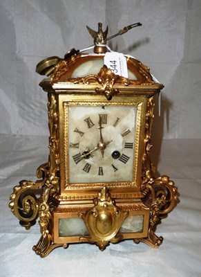 Lot 344 - A gilt metal and alabaster mounted striking mantel clock