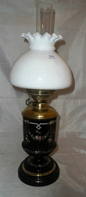 Lot 355 - Black enamel, floral oil table lamp