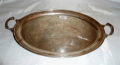 Lot 373 - A silver twin handled tray engraved and dated 1971