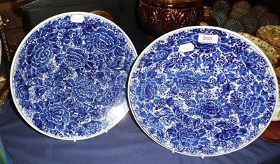 Lot 383 - A pair of 20th century Japanese blue and white florally decorated plates