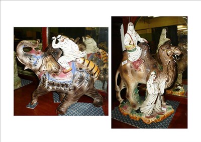 Lot 395 - Two Capodimonte figures, a camel and an elephant with seated figures