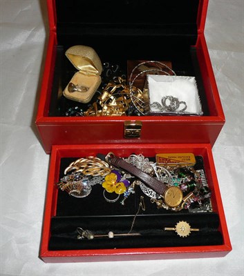 Lot 410 - A quantity of costume jewellery in a red jewellery box including a 9ct gold and opal bar...