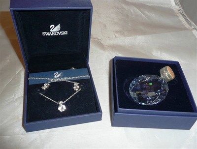 Lot 439 - Swarovski pendant and matching earrings on chain and a circular extendable window ornament (both in